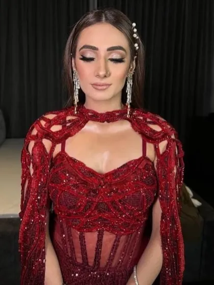 A client looking stunning in my bestselling crimson red gown, effortlessly embodying elegance and grace.