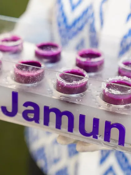 A tray of our Jamun Shots being served, showcasing the elegant presentation of our innovative desserts.