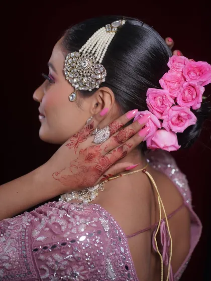 A view of the beautiful floral hairstyle from the back, showing how every element of the look is thoughtfully designed.
