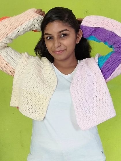 A front view of the pastel color-block cardigan.