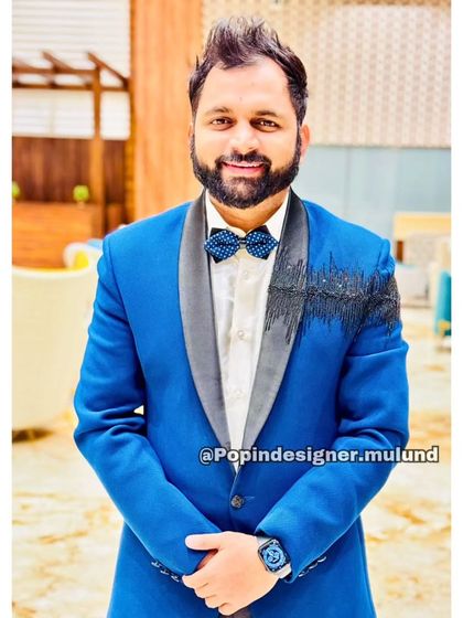 This client chose a bold royal blue suit with black shoulder embroidery. It’s a modern and stylish look that commands attention.