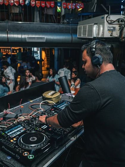 A side view of my setup at Flo Churchstreet. You can see the complexity of the mixer, players, and cables that all come together to create the final sound.