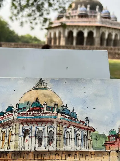 My sketchbook showing the Isa Khan's Tomb painting, with the actual monument in the background. It's always a pleasure to sketch this beautiful structure.