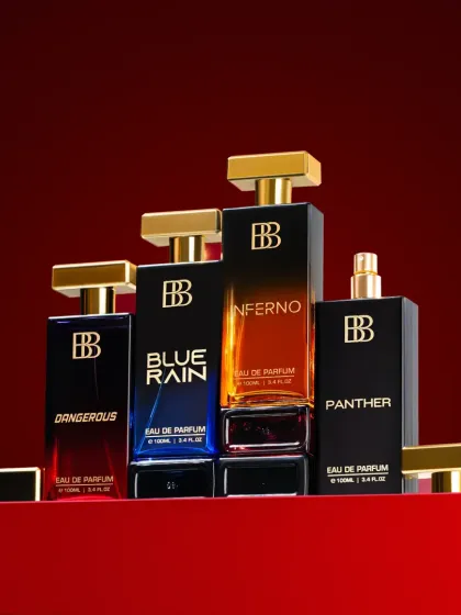 A hero shot for a luxury perfume range. We arranged the full collection to create a powerful, unified image, using a rich red background and precise lighting to make the glass bottles and gold caps stand out. This type of group shot is perfect for website banners and ad campaigns.