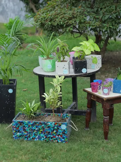 This is what sustainability looks like in your garden. Our collection of recycled plastic planters, from large statement pieces to small pots, brings unique color and character to any green space, all while keeping plastic out of landfills.