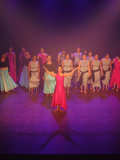 The final pose from a performance, showcasing the unity and artistry of our students.