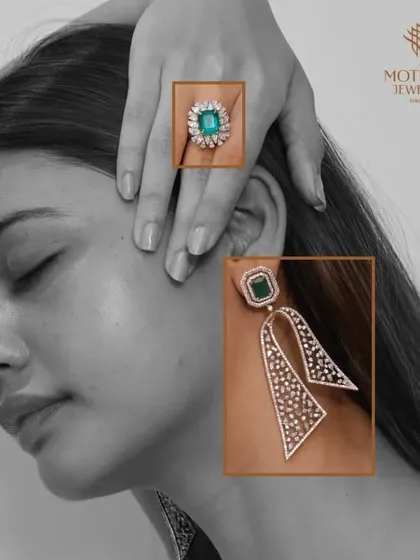 A model presents a unique set of earrings and a matching ring, featuring a striking combination of emeralds and geometric diamond designs.