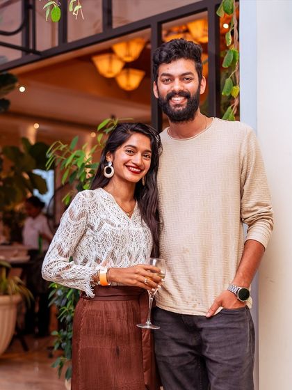 A happy couple poses for a photo, enjoying a day out at Roxie.