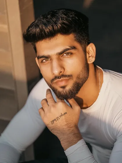 A powerful close-up portrait of a male model, focusing on expression and strong features. This type of headshot is essential for any professional model's portfolio.