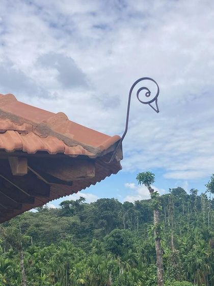 A handcrafted metal detail on the roof of the Chickmagalur estate villa, a small touch of artistry that adds character to the building.