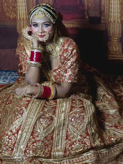 The flare on this red and gold embroidered lehenga is incredible. It’s perfect for creating dramatic and memorable wedding photos.
