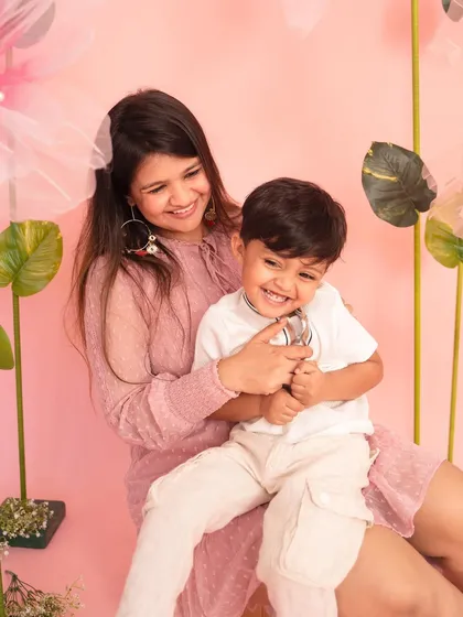 Pure joy and laughter between a mother and her son. This candid moment was captured during my pink floral-themed Mother's Day mini-sessions.