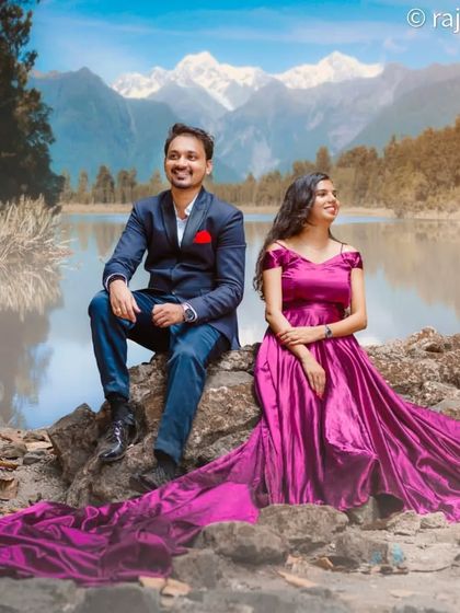 This off-shoulder magenta gown with a long trail creates a beautiful picture against a scenic mountain and lake backdrop.