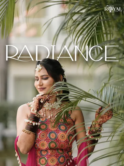 A radiant portrait of the bride-to-be during her Haldi ceremony, framed by palm leaves.