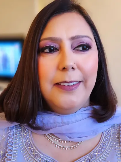 This client from Ludhiana exudes timeless elegance. The soft purple eyeshadow complements her lavender outfit perfectly, creating a harmonious and polished look.