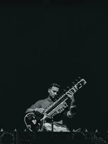 A black and white portrait from my Ahmedabad show, capturing a moment of deep concentration. The focus required to play is a meditation in itself.
