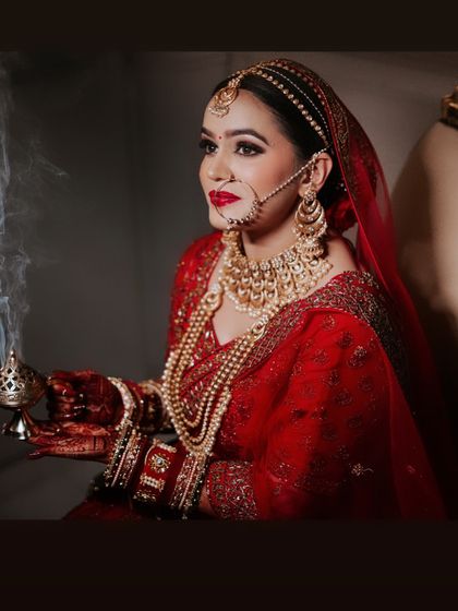 A beautiful shot of my bride holding a traditional incense burner. The makeup is designed to look regal and timeless, fitting for a queen.