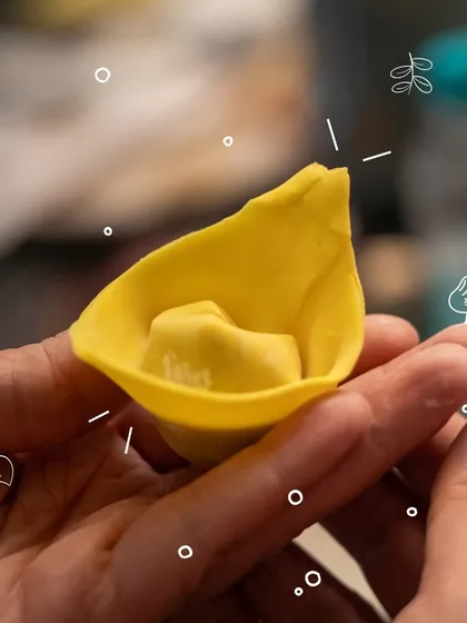 The delicate art of the fold. This close-up shows a beautifully crafted tortelloni, shaped by hand during our dim sum making experience. It’s all about patience, technique, and a little bit of finesse.