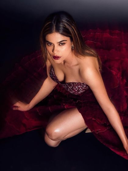 A close-up that captures the intensity of the look. Aaditi's sculpted features and piercing gaze are enhanced by the bold makeup, creating a powerful and captivating image.