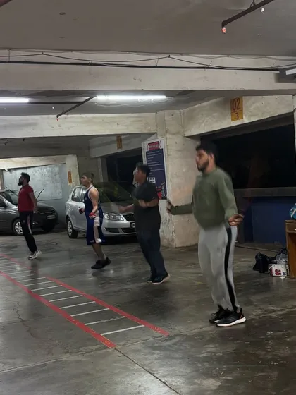 This is a look at our men's evening batch, focused and disciplined during a jump rope warm-up. Footwork is the foundation of every great boxer, and we drill it relentlessly.