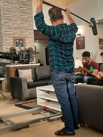 A shot from the set of a big upcoming project. You can see the full crew at work, including the boom operator and camera dolly. I feel completely at home in this environment.