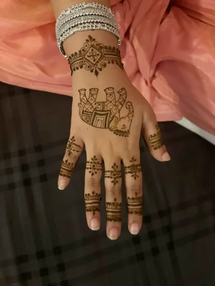 A playful and unique design featuring a Hamsa Hand or Fatima Hand motif.