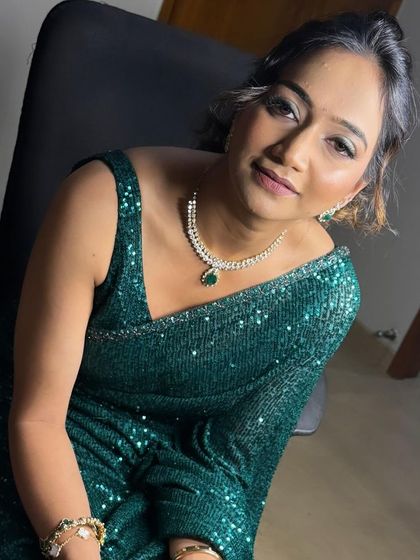 A close-up of the client looking elegant with her messy updo.