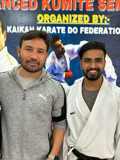 With fellow coaches and seniors at a kumite seminar. Continuous learning is a core part of our philosophy, for both students and instructors.