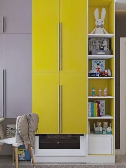 A vibrant and cheerful kids' room with a yellow and lilac wardrobe. The design incorporates a study desk and open shelving, creating a bright and inspiring space for a child to grow.