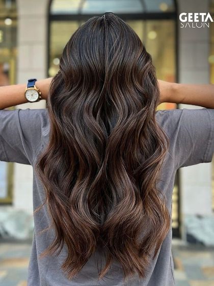 A natural-looking balayage on long hair, perfect for someone wanting a low-maintenance but stylish colour.