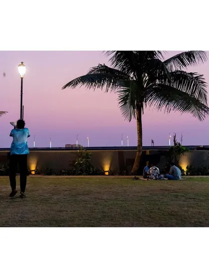 As dusk settles over the Worli Fishing Village, the Gora Dabkal ground transforms. The landscape lighting design provides safety and ambiance, ensuring the park remains a cherished community hub for relaxation and connection well into the evening, with the sea-link as a backdrop.