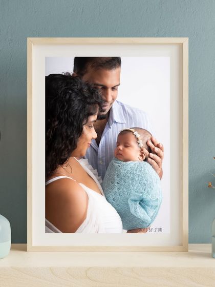 A framed family portrait, showcasing how your photos can become a central piece of your home's decor.