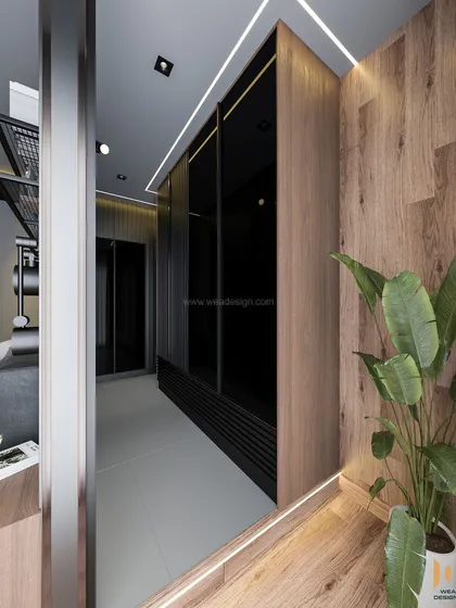 A look at the wardrobe and passage area, showcasing the use of wood panels and profile lighting to create a warm, inviting path.