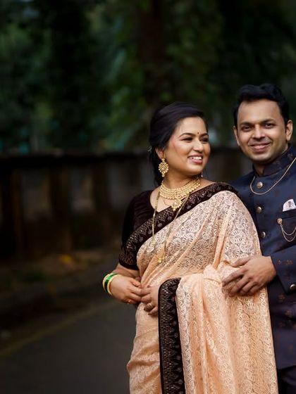 An elegant outdoor portrait of a newly engaged Marathi couple. The soft, natural lighting and classic pose create a timeless and sophisticated image.
