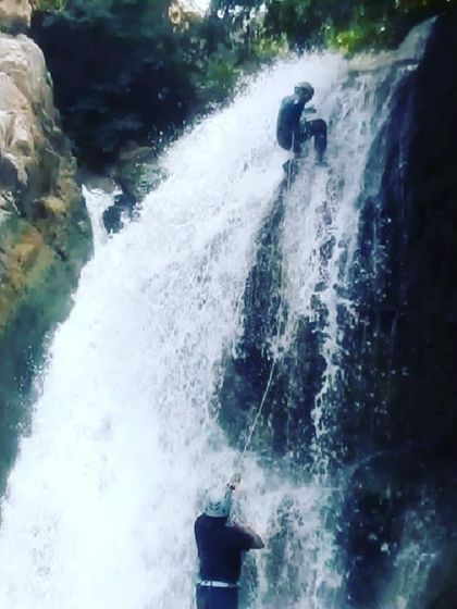 A view from below showing the full scope of the waterfall rappel at City Falls.