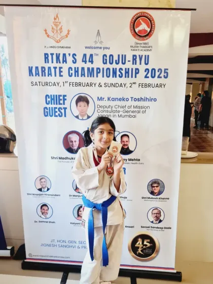 Posing with her silver medal at our annual championship. Each tournament is an opportunity for students to demonstrate their progress and gain valuable experience.