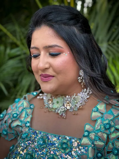 A serene shot with eyes closed, showing the blend of colors on her eyelids.