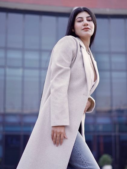A walking shot that demonstrates the movement and fit of the clothing, ideal for a brand's lookbook.