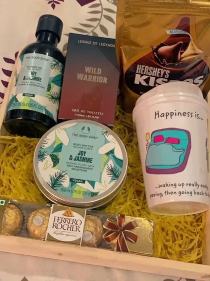 For the one who loves good skincare, this hamper features products from The Body Shop's Joy & Jasmine range, paired with Ferrero Rocher chocolates and a fun, quirky mug.