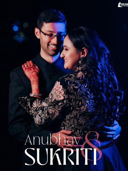 A glamorous portrait from a cocktail night in Jaipur. The dramatic lighting and the couple's elegant attire create a sophisticated and celebratory mood.