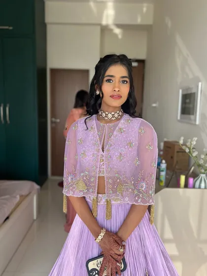 Radiating elegance in soft purples. This look is perfect for a daytime event or a cocktail party.