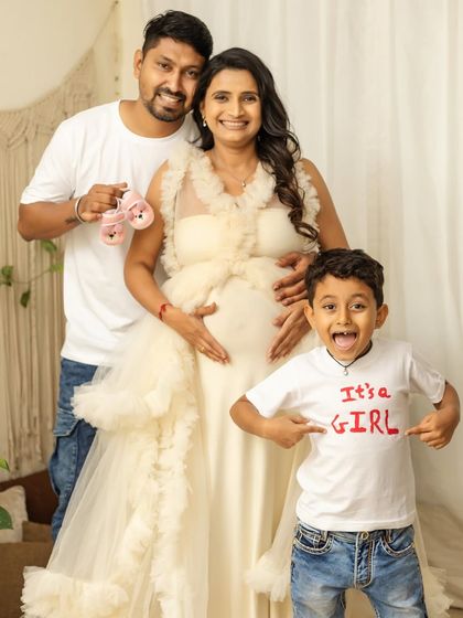 The excitement is real. This fun family photo, with your son proudly announcing "It's a Girl," is a perfect way to share your joy with everyone.