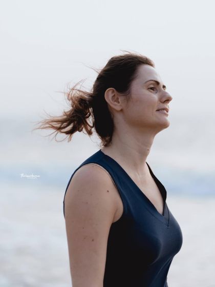 A profile shot capturing a thoughtful expression with the wind in her hair. These candid, atmospheric shots are a beautiful addition to any portrait session.