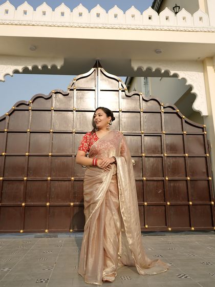 A full-length shot showcasing the entire look. The statement earrings provide the perfect amount of adornment for an elegant and balanced appearance.