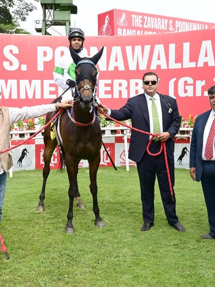 Flight of Fancy, with jockey Vivek.G, stands with the winning team after securing the memorial million race.