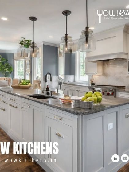 Experience the harmony of elegance and functionality. This large island kitchen combines classic white shaker cabinets with a contrasting grey island, dark wood floors, and beautiful pendant lighting.