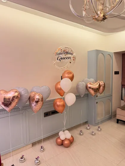 We love creating the perfect birthday aesthetic. This assorted balloon bouquet features rose gold hearts, a personalized "Happy Birthday Queen" bubble balloon, and a soft pastel color palette for a totally chic celebration.