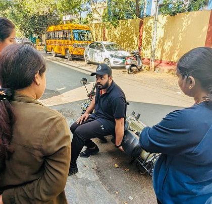 A group of women attentively listening to the coach. This is the start of their journey from pillion to rider, soaking in the knowledge that will give them freedom on the road.