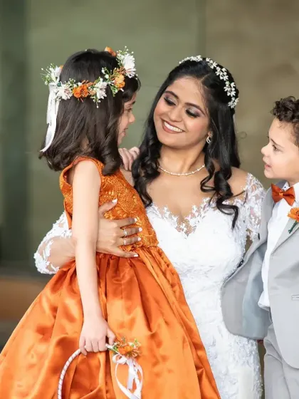 A sweet and candid moment between the bride and her adorable flower girl and page boy. These are the unscripted interactions that make for heartwarming photos.