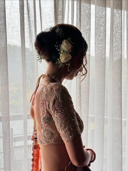 Another angle of this dreamy, romantic bridal bun. The silhouette against the window light is just so beautiful.